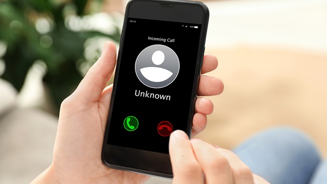 person_declining_incoming_unknown_call_on_smartphone